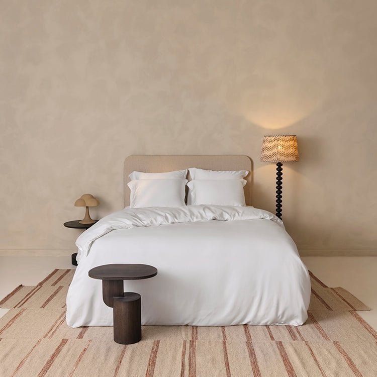 Tencel™ Sateen Duvet Cover in White styled on a bed, wide view