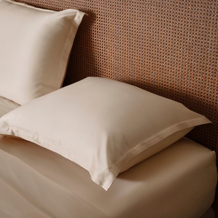 Close-up of pillows in the Tencel™ Sateen Duvet Cover set in White Sand