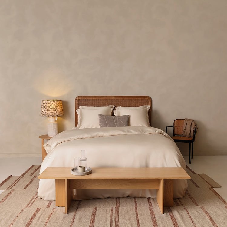 Tencel™ Sateen Duvet Cover in White Sand styled on a bed, wide view