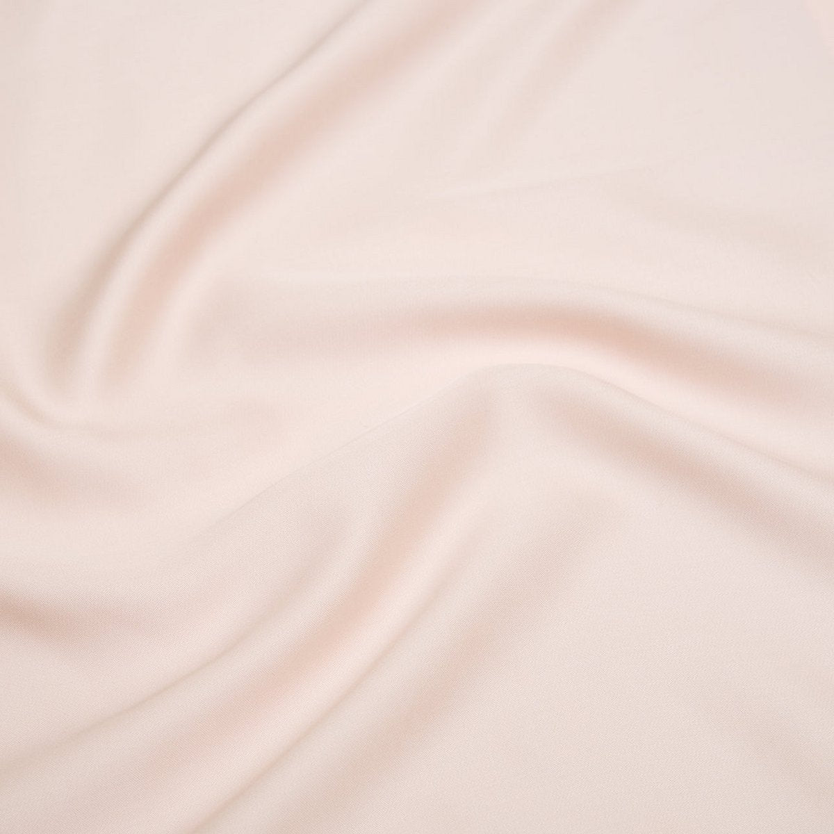 Close-up of the Tencel™ Sateen Pillowcase in Peach White fabric texture