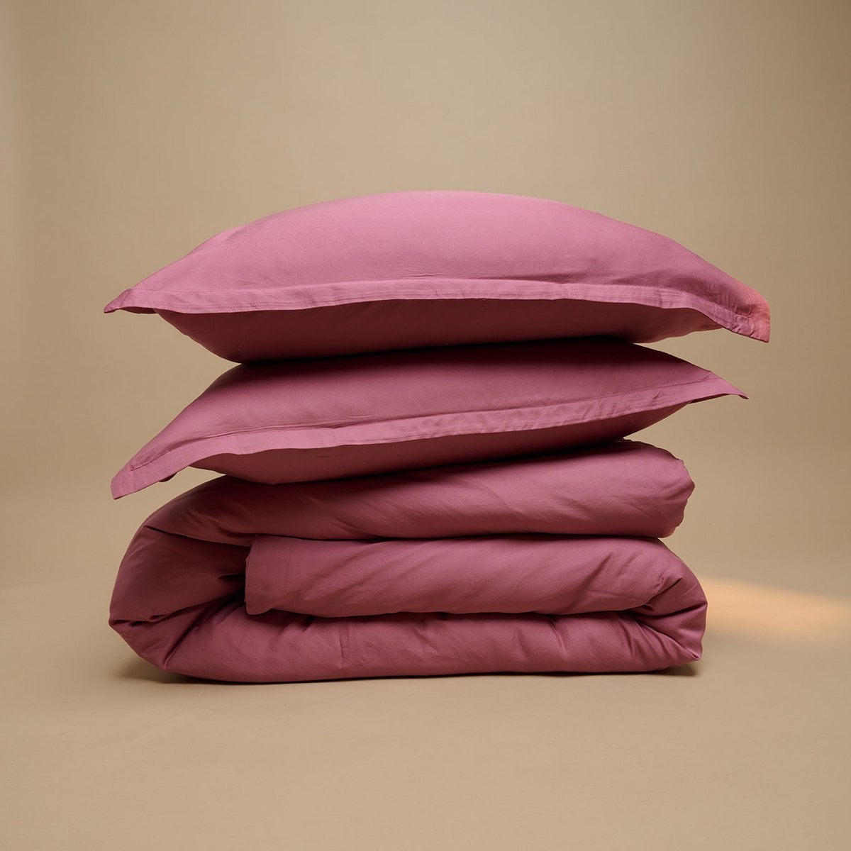 Tencel™ Twill Duvet Cover and pillows in Dusty Rose, folded