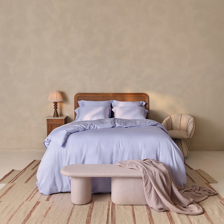 Tencel™ Twill Duvet Cover in Lavender Blue styled on a bed, wide view