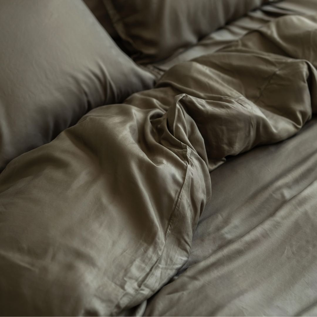 Close-up of pillows in the Tencel™ Twill Duvet Cover set in Olive Green