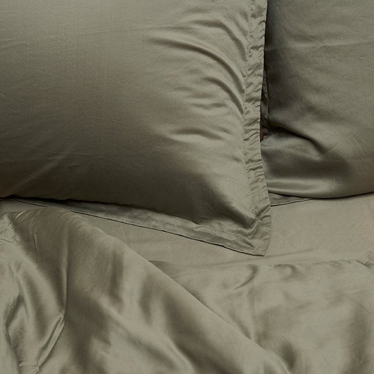 Close-up of a pillow in the Tencel™ Twill Duvet Cover set in Olive Green