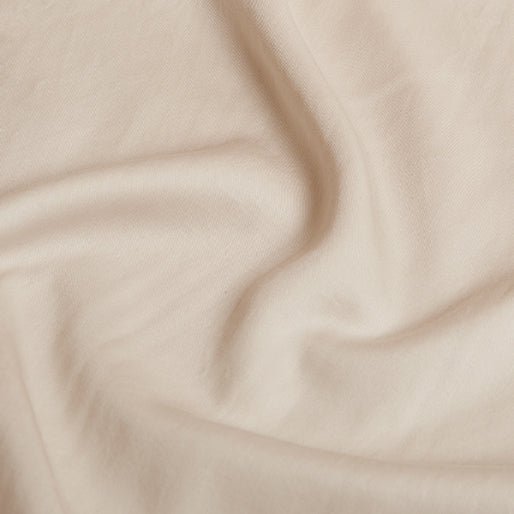 Close-up of the Tencel™ Twill fabric texture in Beige