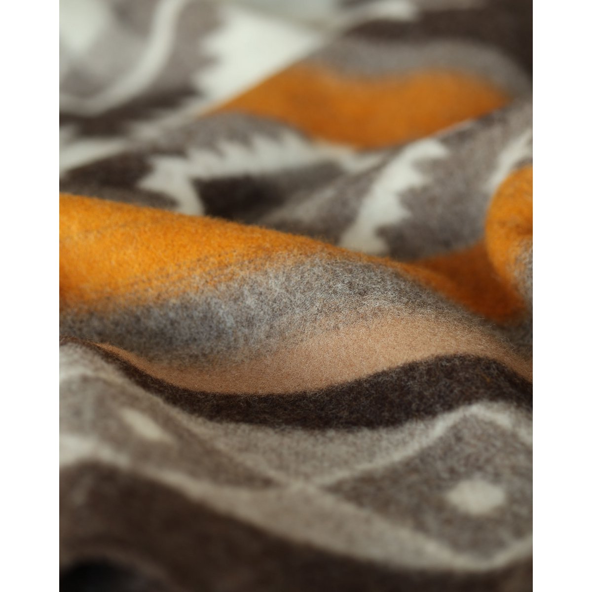 Close-up of the Tribe bedspread's intricate Ukrainian motif pattern