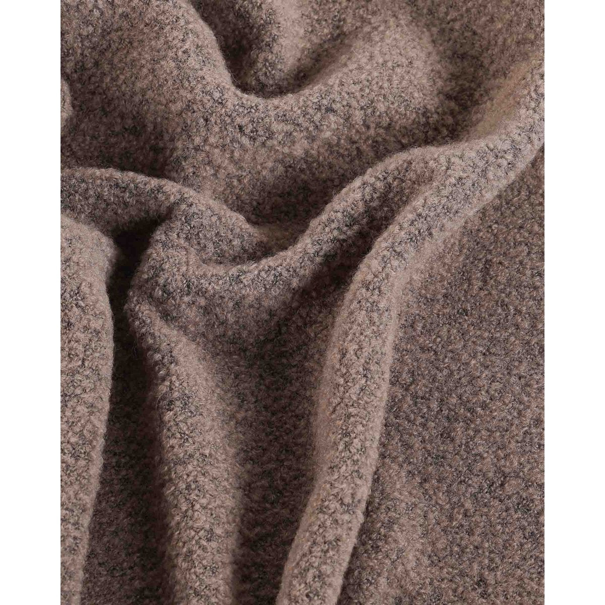 Detail shot of the Paris throw's fringe and edge finish
