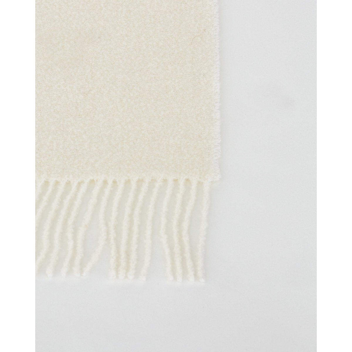 Detail shot of the Paris throw's fringe and edge finish