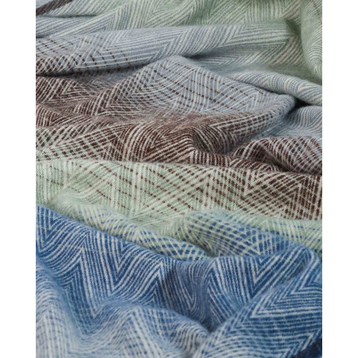 Close-up of Manoria Acqua's woven zigzag wool texture