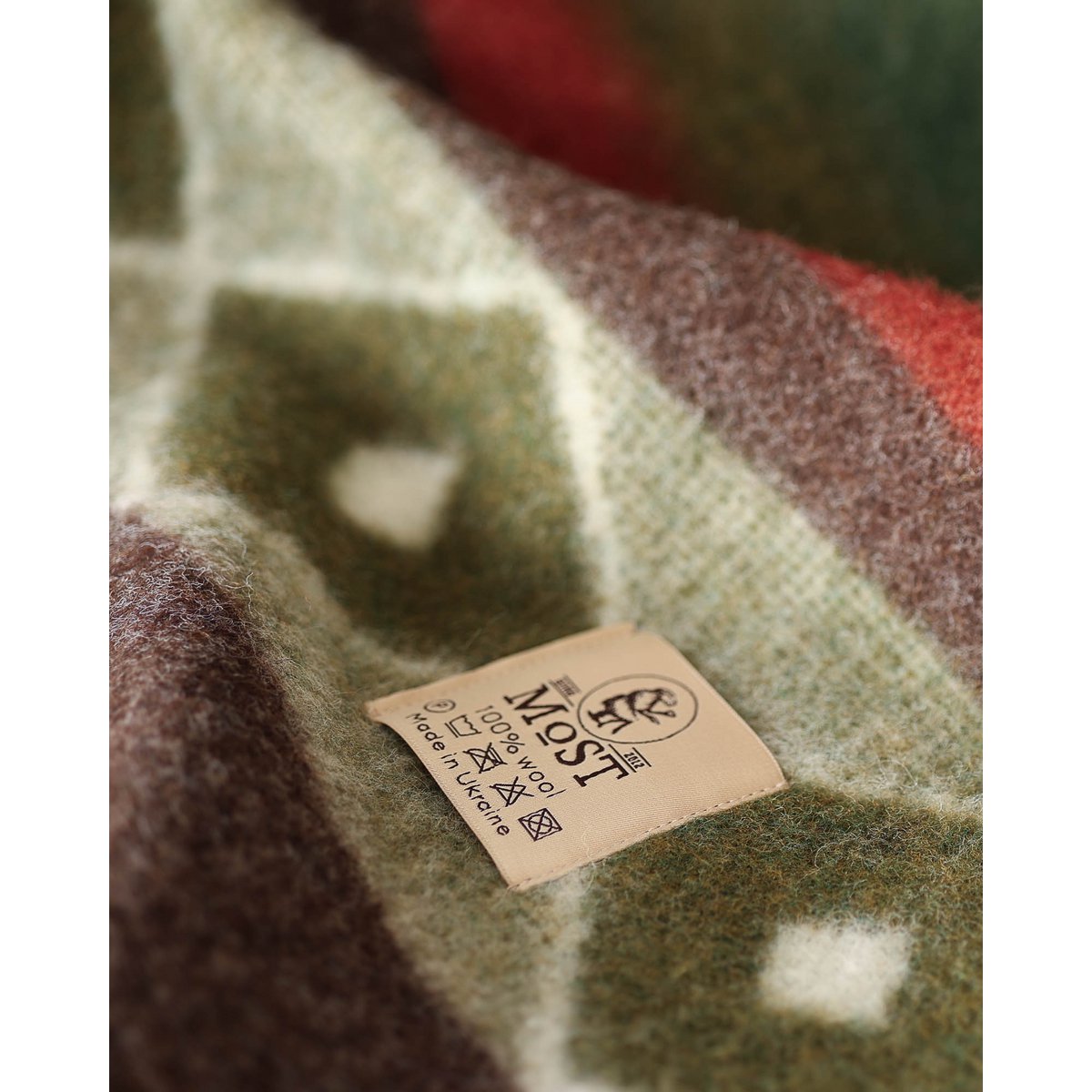Close-up of the Tribe throw's intricate Ukrainian motif pattern